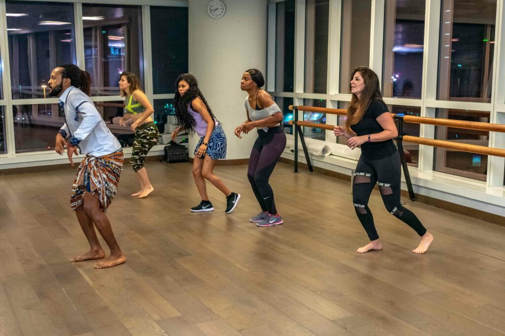 Energetic zumba dance class with diverse adults embracing active lifestyle indoors.